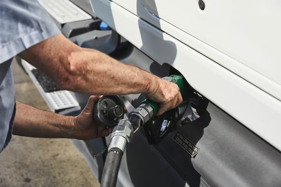 Card Security Driver fueling gas into the truck