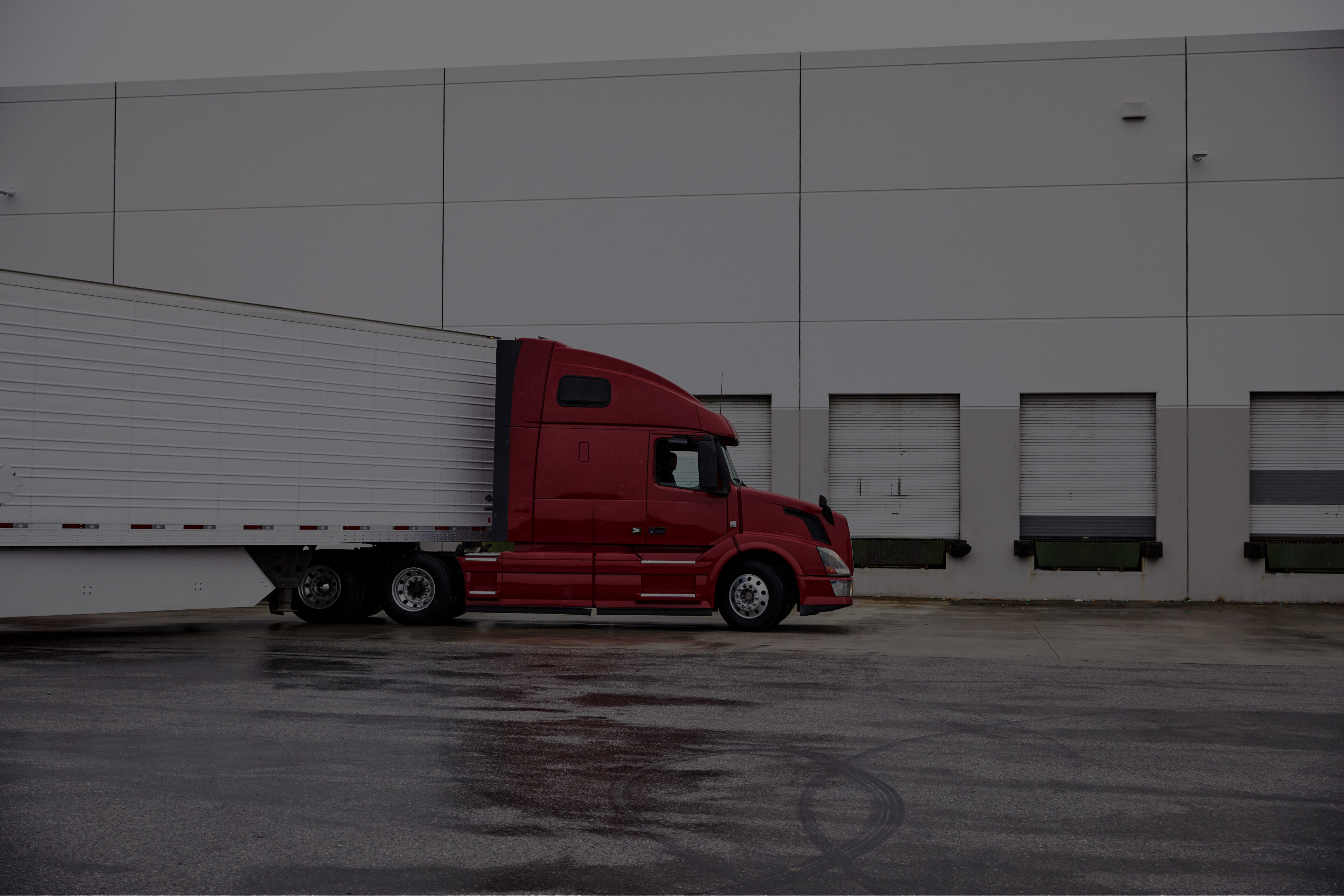 carrier_header truck parked at loading dock